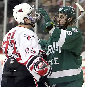 Photo By: Michelle Bishop Bemidji State's Radoslav Illo adjusts the facemask of UNO's Eric Olimb during the first period. Illo received a penalty on the play. UNO and Bemidji State skated to a 2-2 tie Friday night at Qwest Center Omaha. (Photo by Michelle Bishop) (Michelle Bishop)
