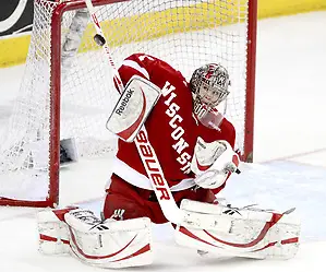 Photo By: Michelle Bishop Wisconsin goalie Scott Gudmandson blocks a shot during the third period. No. 16 UNO beat No. 7 Wisconsin 4-3 Saturday night at Qwest Center Omaha. (Photo by Michelle Bishop) (Michelle Bishop)