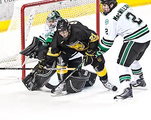 Photo By: Brad Olson 25 Nov 11: Jeff Collett (Colorado College-21)Brad Eidsness (North Dakota-31)Andrew MacWilliam (North Dakota-2) The University of North Dakota Fighting Sioux host the Colorado College Tigers in a WCHA matchup at Ralph Engelstad Arena in Grand Forks, ND. Subway Holiday Classic. Final Score:North Dakota 7- Colorado College 6. (Brad Olson)