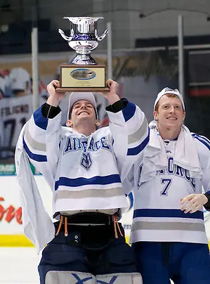 Photo By: 2012 Omar Phillips AHA tournament MVP Jason Torf and teammate Casey Kleisinger of Air Force celebrate their AHA championship victory over RIT (2012 Omar Phillips)