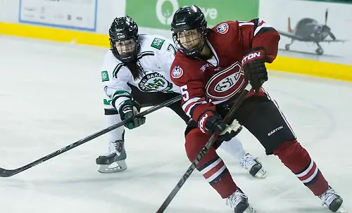 Photo By: Bradley K. Olson 29 Nov.14: University of North Dakota hosts St. Cloud State University in a WCHA match-up at the Ralph Engelstad Arena in Grand Forks, ND Lexi Slattery (St.Cloud State University-15) Jordan Hampton (North Dakota-7) (Bradley K. Olson)
