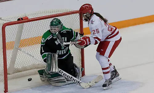 Photo By: BRADLEY K. OLSON (Erika Sowchuk-25 Wisconsin) (Shelby Amsley-Benzie-1 North Dakota )08 March 13 University of North Dakota and Wisconsin in the WCHA Final Face Off (BRADLEY K. OLSON)