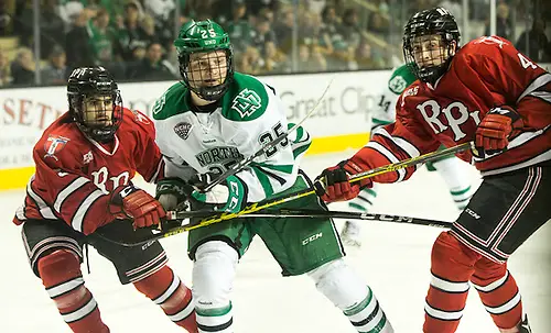 Photo By: Bradley K. Olson Joel Janatuinen (North Dakota-25) Charlie Manley (RPI-5) 16 October 15 RPI and University of North Dakota meet in a non conference contest at the Ralph Engelstad Arena in Grand Forks, ND (Bradley K. Olson)