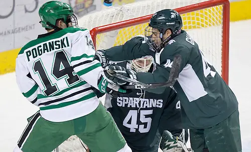 Photo By: Bradley K. Olson Austin Poganski (North Dakota-14) Butrus Ghafari (Michigan State-44)16 November 26 Michigan State University and University of North Dakota meet in a non conference contest at Ralph Engelstad Arena (Bradley K. Olson)