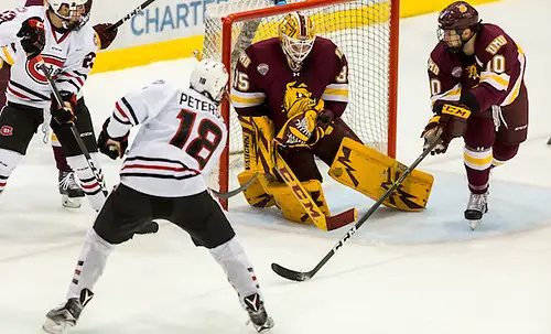 Photo By: Bradley K. Olson Judd Peterson (SCSU-18) Hunter Miska (Minnesota-Duluth-35) 16 November 05 University of Minnesota Duluth and St. Cloud State University meet in a NCHC conference contest at Herb Brooks National Hockey Center (Bradley K. Olson)