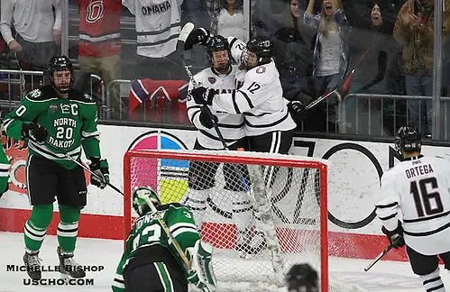 Photo By: Michelle Bishop Omaha celebrates David Pope's (12) goal during the third period. North Dakota beat Omaha 7-3 Saturday night at Baxter Arena. (Photo by Michelle Bishop) (Michelle Bishop)