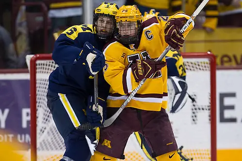 Photo By: Jim Rosvold 14 Jan 16: Griffin Luce (Michigan -5), Justin Kloos (Minnesota - 25). The University of Minnesota Golden Gophers host the University of Michigan Wolverines in a B1G matchup at Mariucci Arena in Minneapolis, MN. (Jim Rosvold)