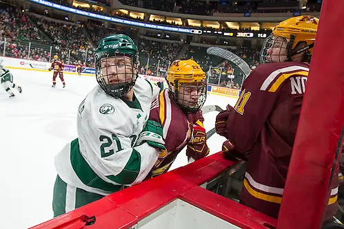 Photo By: Jim Rosvold 28 Jan 17: Gerry Fitzgerald (Bemidji State - 21), Tyler Sheehy (Minnesota - 22). The Bemidji State Beavers play against the University of Minnesota Golden Gophers in the third place game of the North Star College Cup at the Xcel Energy Center in St. Paul, MN. (Jim Rosvold)
