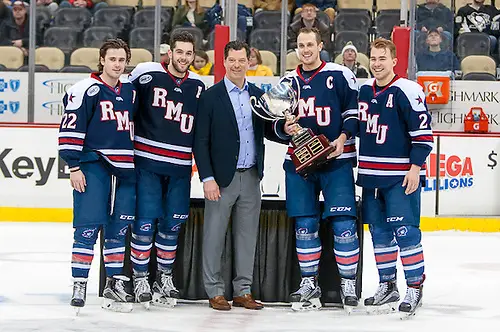 Photo By: Omar Phillips Robert Morris captains are presented with their second straight Three Rivers Classic trophy (Omar Phillips)