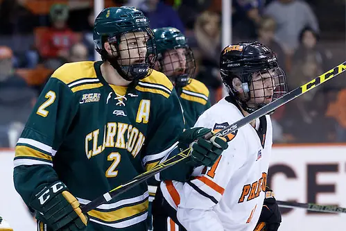 Photo By: Shelley M. Szwast James de Haas (Clarkson - 2) and Alex Riche (Princeton - 11) battle in front of the net. (Shelley M. Szwast)