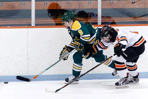 Photo By: (c) Shelley M. Szwast 2016 Genevieve Bannon (Clarkson - 9) plays the puck as Molly Strabley (Princeton - 2) gives chase. ((c) Shelley M. Szwast 2016)
