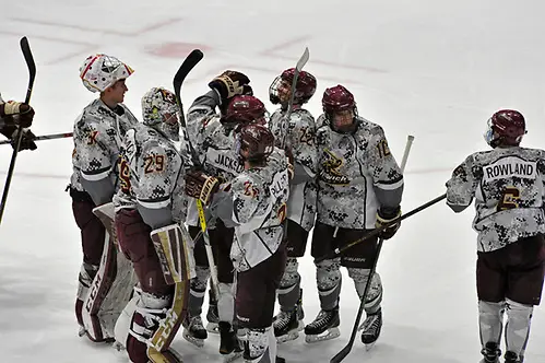 Norwich celebrates win over Adrian Norwich celebrates its win over Adrian in OT. (Angelo Lisuzzo)