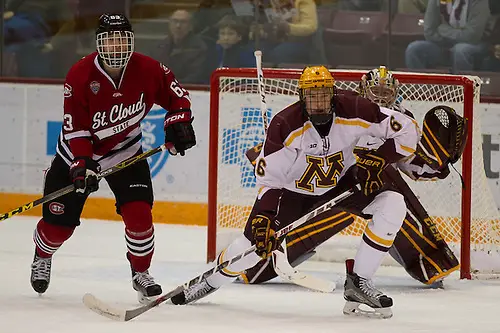 Photo By: Jim Rosvold 27 Nov 15: Patrick Russell (St. Cloud - 63), Ryan Collins (Minnesota - 6). The University of Minnesota Golden Gophers host the St. Cloud State University Huskies in an non-conference matchup at Mariucci Arena in Minneapolis, MN. (Jim Rosvold)