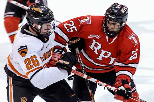 Photo By: Shelley M. Szwast Ryan Siiro (Princeton - 26) and Drew Melanson (Rensselaer - 25) battle at center ice. (Shelley M. Szwast)