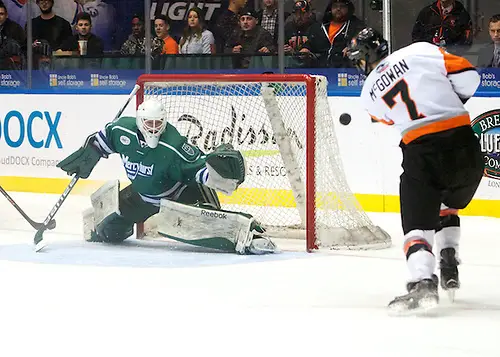 Photo By: Omar Phillips A Brad McGowan (7 - RIT) shot sails just wide of Brandon Wildung (1 - Mercyhurst) (Omar Phillips)