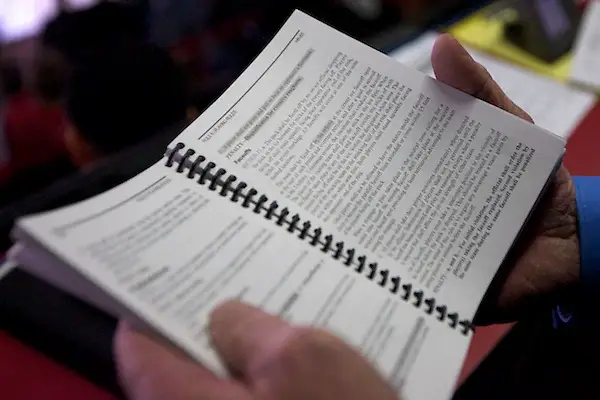 Photo By: Jim Rosvold 16 Dec 11: Reviewing the NCAA Rule Book. The St. Cloud State Huskies host the Denver University Pioneers in a WCHA match up at the National Hockey Center in St. Cloud, MN. (Jim Rosvold)