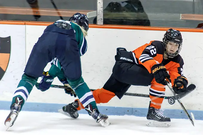 Photo By: (c) Shelley M. Szwast 2016 Kiersten Falck (Princeton - 22) and Maggie Knott (Mercyhurst -4) battle along the boards. ((c) Shelley M. Szwast 2016)