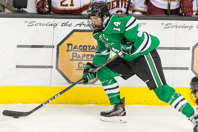 Photo By: Bradley K. Olson Austin Poganski (North Dakota-14) 2018 Jan. 27 The University of North Dakota hosts Denver University in a NCHC matchup at the Ralph Engelstad Arena in Grand Forks, ND (Bradley K. Olson)