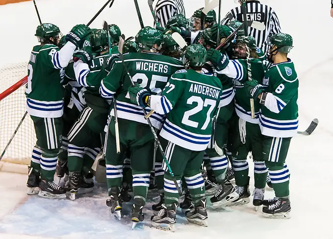 Photo By: 2018 Omar Phillips Mercyhurst players celebrate a win over RIT and clinch the Atlantic Hockey regular season title (2018 Omar Phillips)