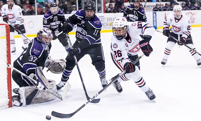 Photo By: Bradley K. Olson Connor LaCouvee (MSU-37) Easton Brodzinski (SCSU-26) Jarred Spooner (MSU-11) 2018 Jan. 12 The St.Cloud State University Huskies host Mankato State University n a non conference matchup at the Herb Brooks National Hockey Center in St. Cloud, MN (Bradley K. Olson)
