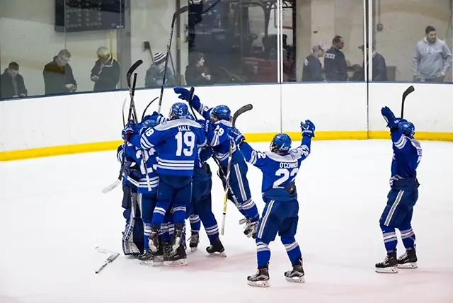 Colby v Geneseo Colby Mules celebrate a win after scoring a second goal with 1.6 second remaining in regulation against the Geneseo Knights at the NCAA Division III men's ice hockey Tournament Second-Round between the Geneseo Knights and the Colby Mules on March 17, 2018. Collby defeats Geneseo 2-1. Photograph by Brett Carlsen for Colby College. (Brett Carlsen)