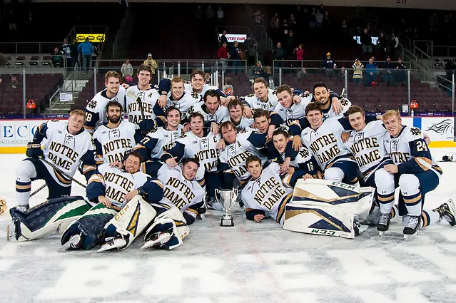 Photo By: Omar Phillips Notre Dame players celebrate with the 2018 Icebreaker Tournament trophy (Omar Phillips)