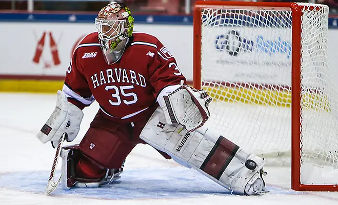 NCAA HOCKEY: MAR 19 Harvard v Quinnipiac March 19, 2016: Harvard Crimson goalie Michael Lackey (35) takes shots during warmups prior to the 2016 ECAC Tournament Championship game between Harvard University and Quinnipiac University at Herb Brooks Arena in Lake Placid, NY. (John Crouch/J. Alexander Imaging)