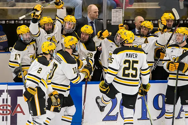 Photo By: 2019 Omar Phillips AIC players celebrate a last second goal in the second period, to go up 2-1 vs Niagara (2019 Omar Phillips)