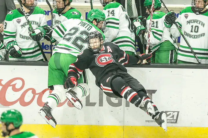 Photo By: Bradley K. Olson Clark Kuster (SCSU-2) Shane Pinto (North Dakota-22) 2019 November 22 St. Cloud State University and University North Dakota meet in NCHC conference game at the Ralph Engelstad Arena Grand Forks, ND (Bradley K. Olson)