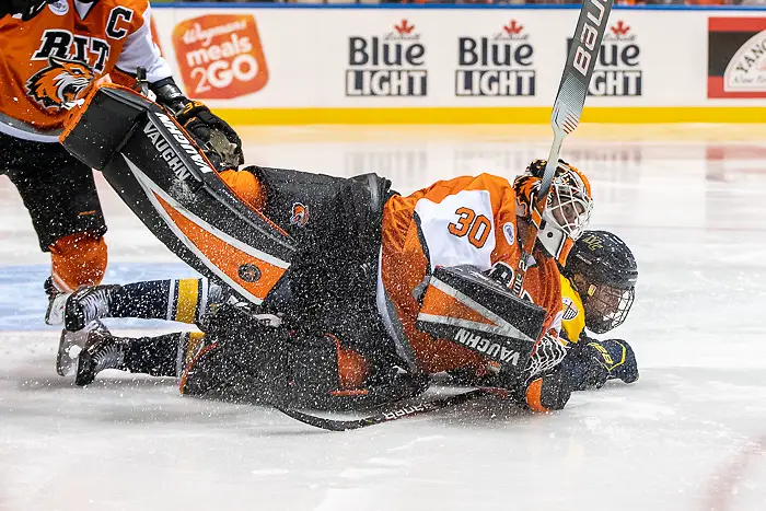 Photo By: Omar Phillips 2019 Hugo Esselin (15 - Merrimack) collides with Logan Drackett (30 - RIT) (Omar Phillips 2019)