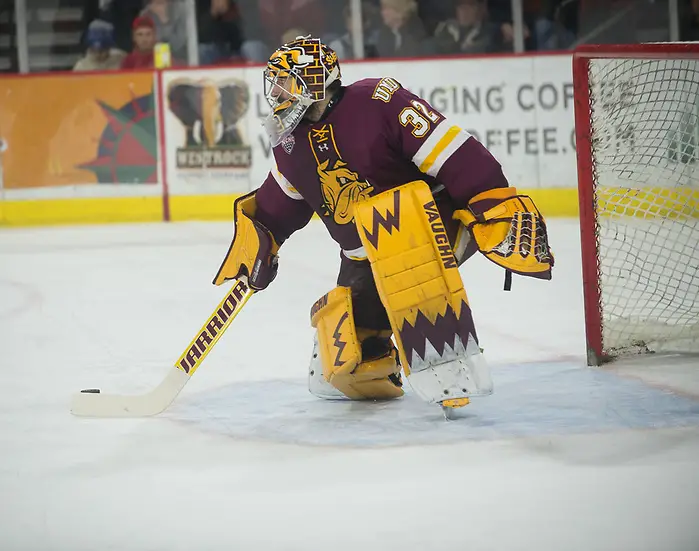 Hunter Shepard of Minnesota Duluth Hunter Shepard of UMD plays the puck. Minnesota Duluth at Denver at Magness Arena, November 17, 2018. (Candace Horgan)