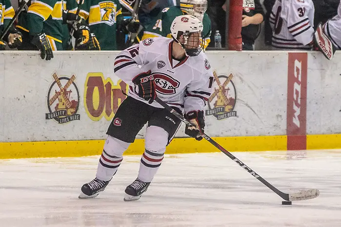 Photo By: Jim Rosvold 19 Oct 18: Jack Ahcan (St. Cloud - 12). The St. Cloud State University Huskies host the Northern Michigan University Wildcats in a non-conference matchup at the Herb Brooks National Hockey Center in St. Cloud, MN. (Jim Rosvold)